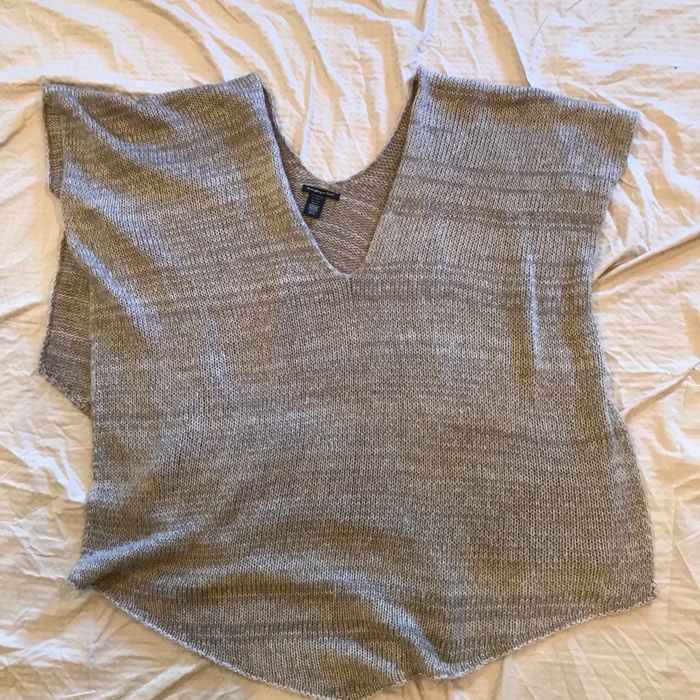 Tan colored shawl with a V-neck cut